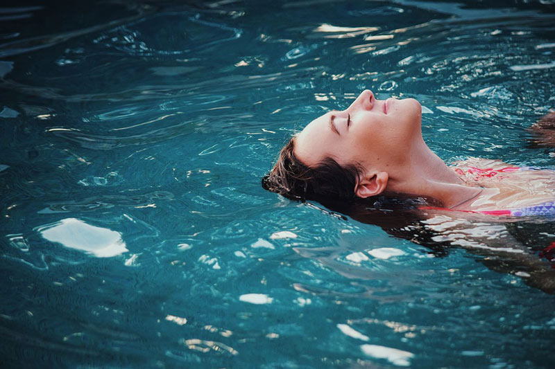 A woman swimming in the pool